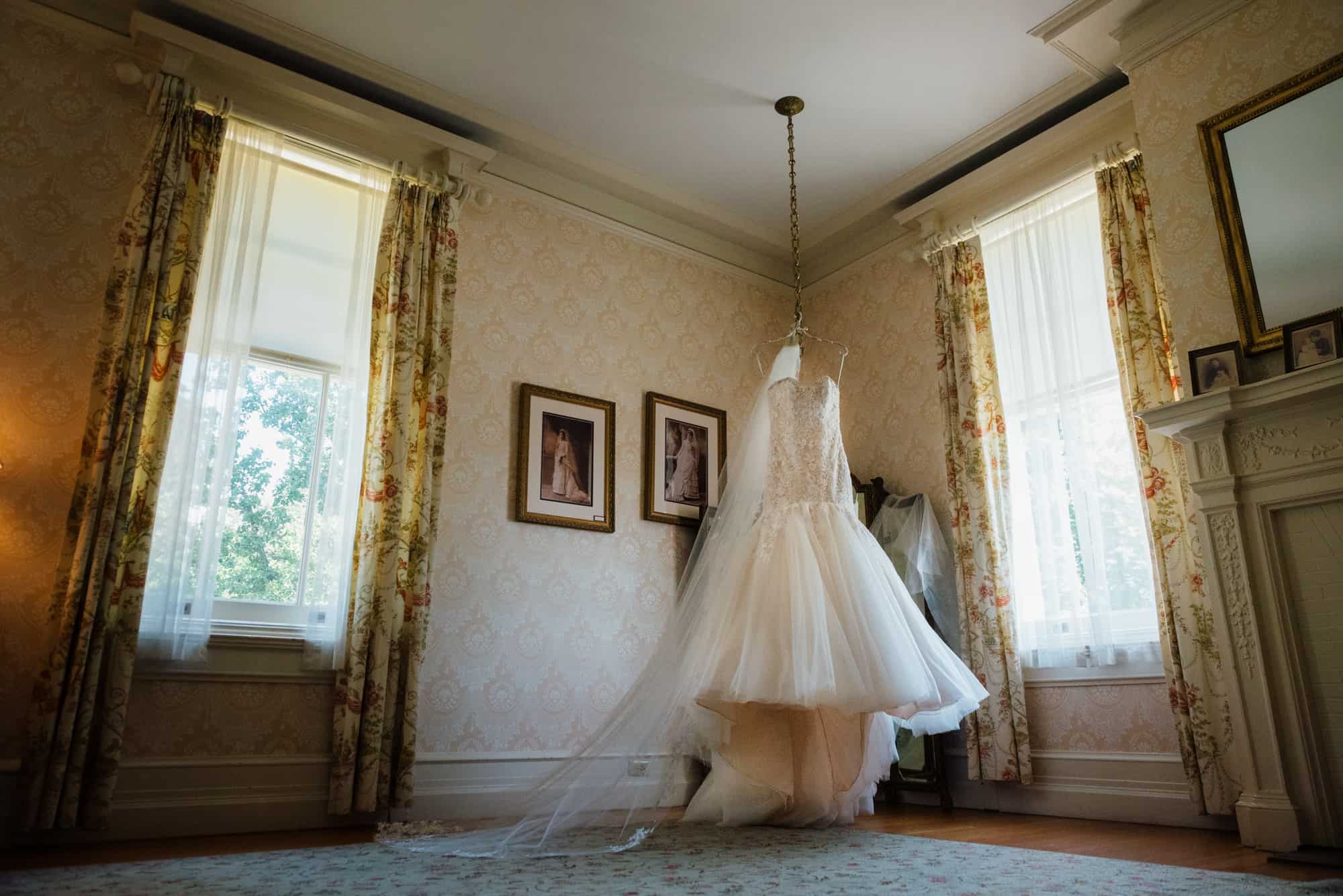 Wedding dress hanging from ceiling at Cairnwood Estate