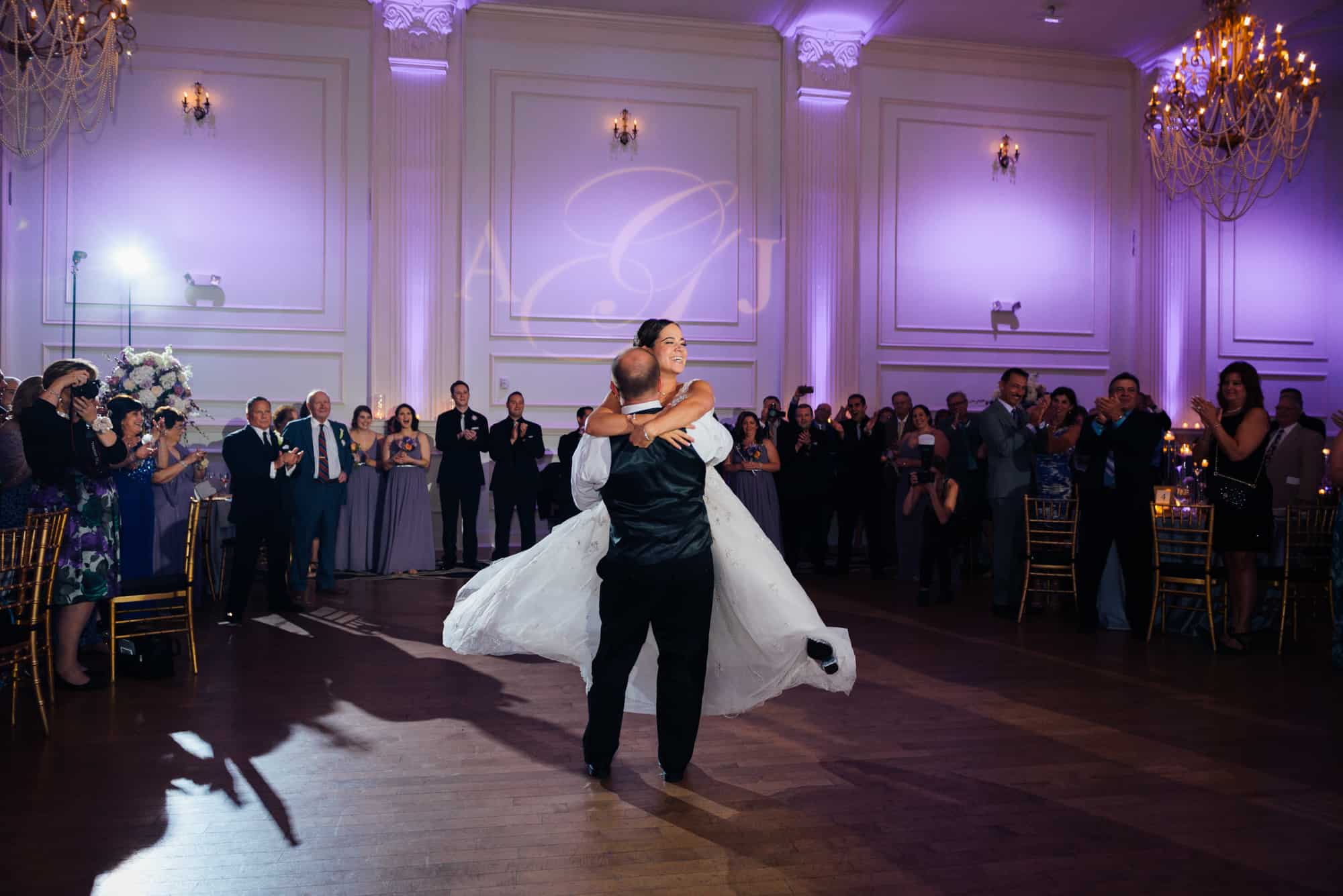 Groom lifting and twirling bride