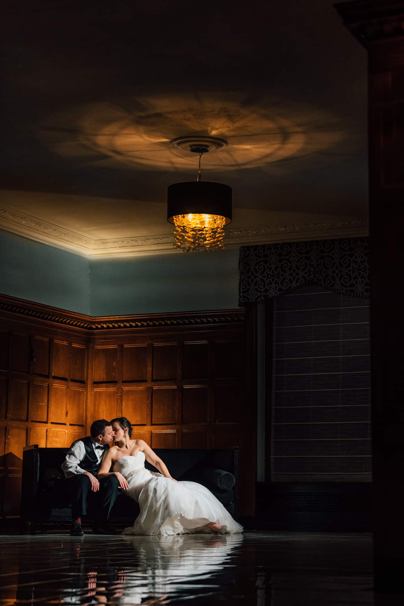 Bride and groom kissing at the Downtown Club