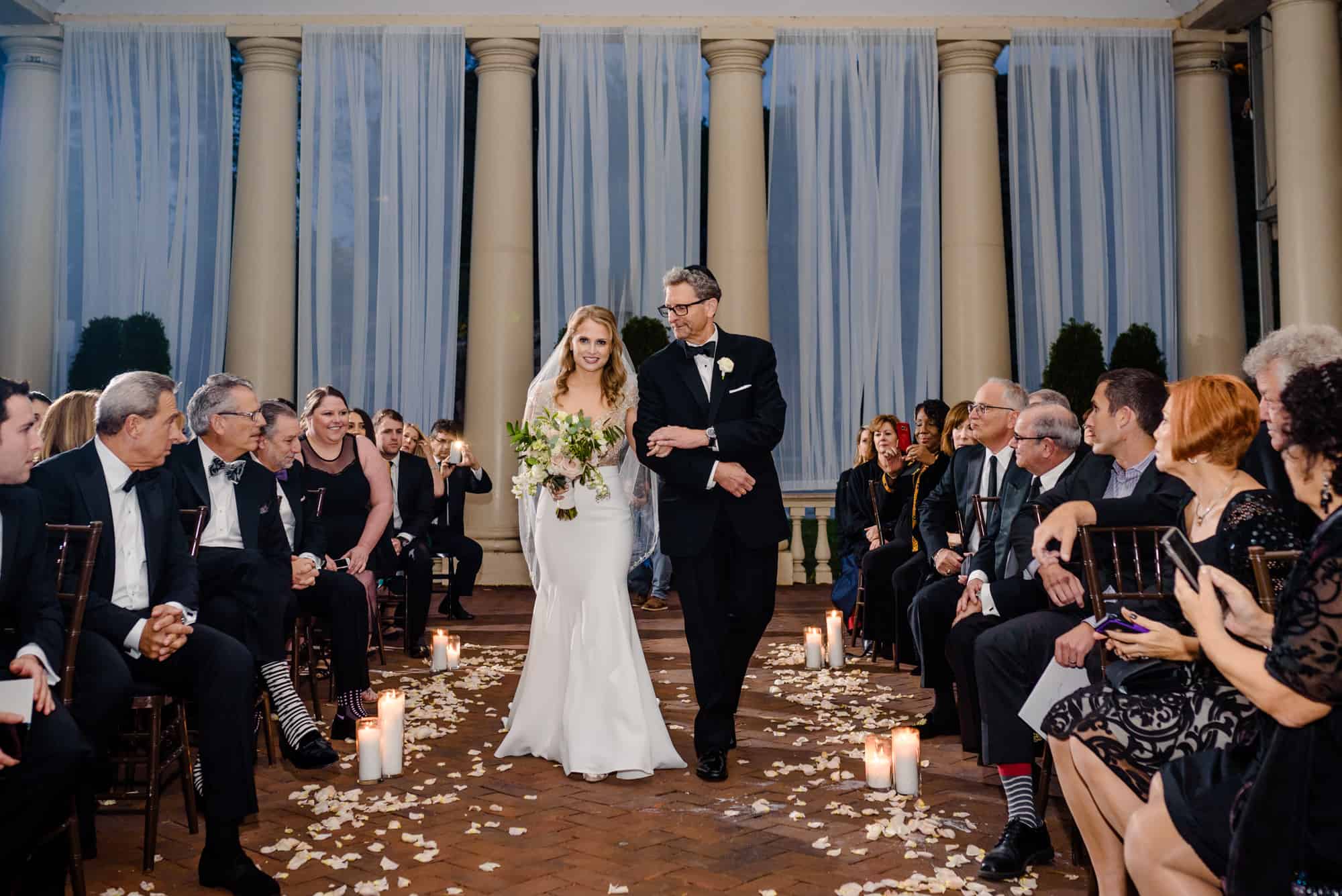 Father looking at bride as he walks her down the aisle at Water Works Philadelphia