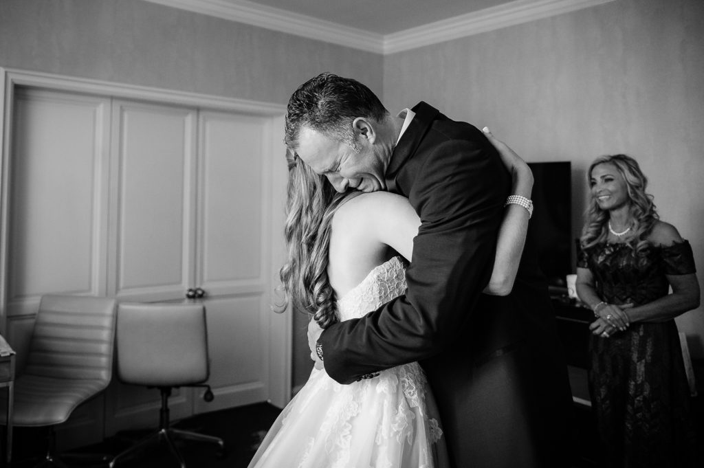 father hugging at her daughter before the wedding