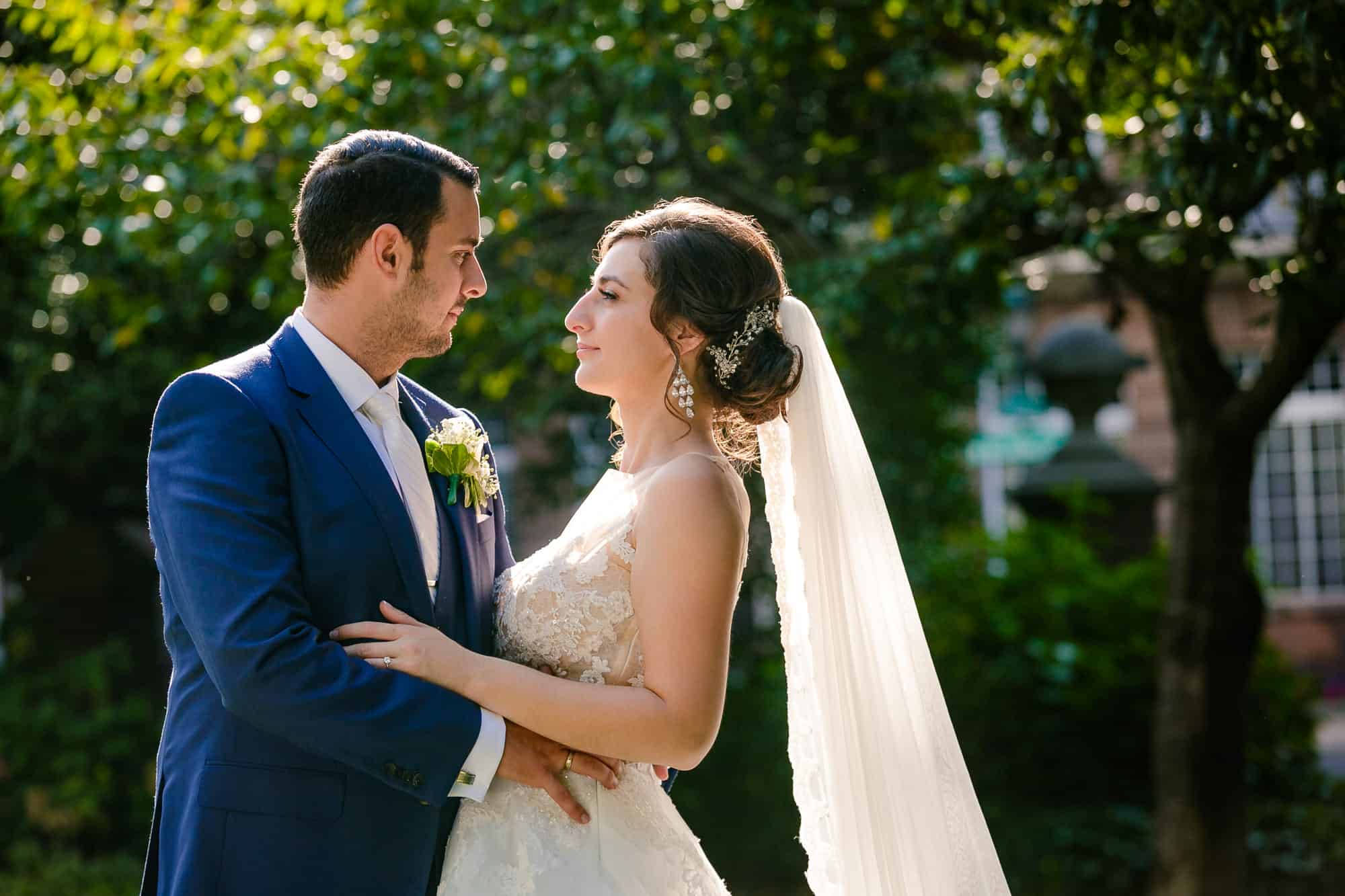 Bride and groom looking into each others eyes in Washington Square Park