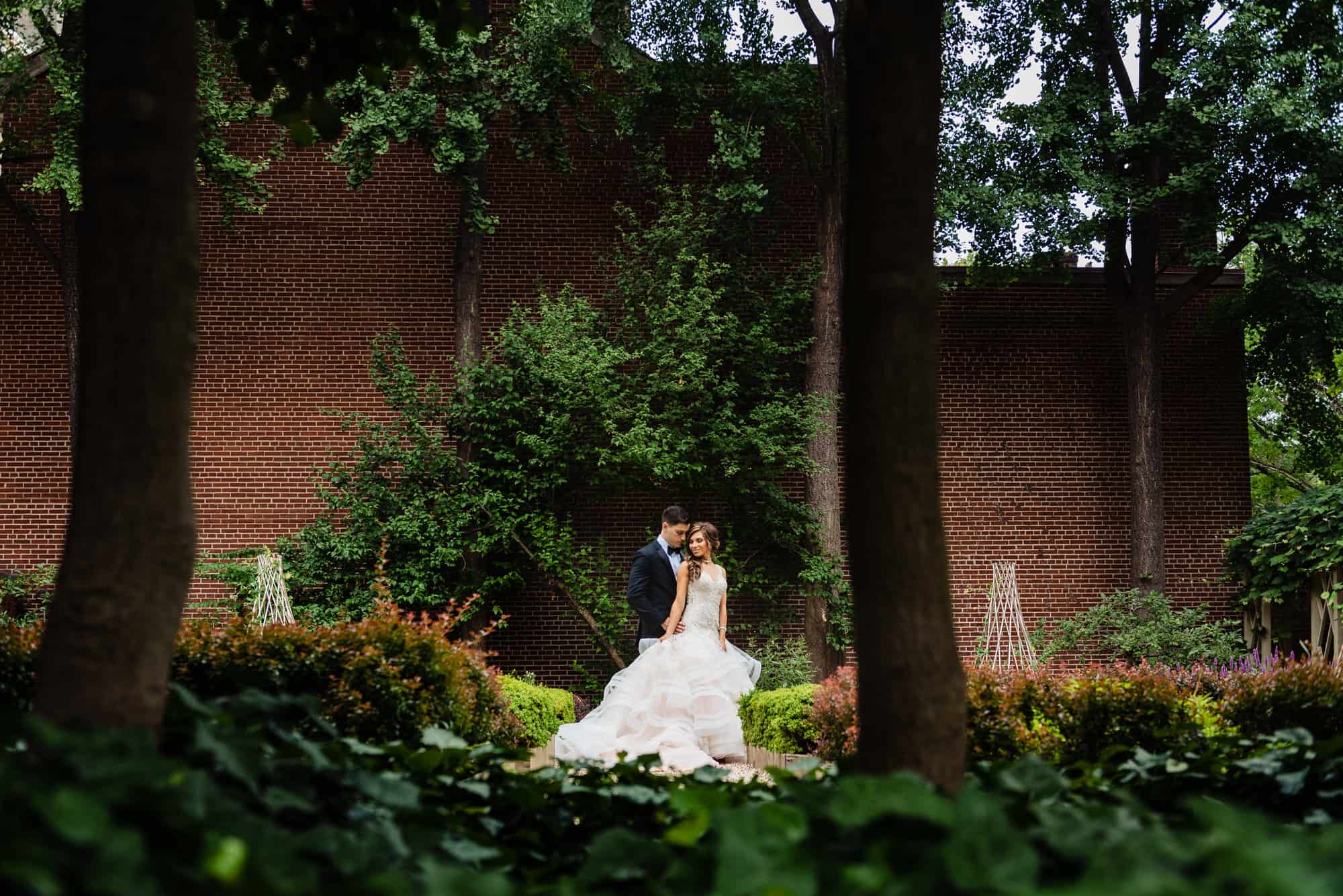 long shot of the couple in the garden