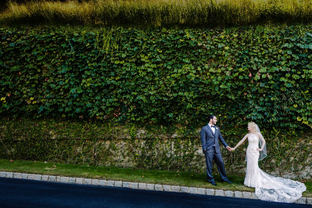 bride and groom holding hands