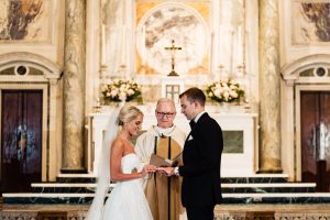 St. Patricks Church|bride putting ring on grooms finger