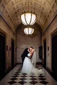 Ritz Carlton Philadelphia Wedding|romantic photo of bride and groom in hotel walkway