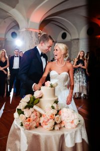 Ritz Carlton Philadelphia Wedding|bride and groom laughing while cutting wedding cake