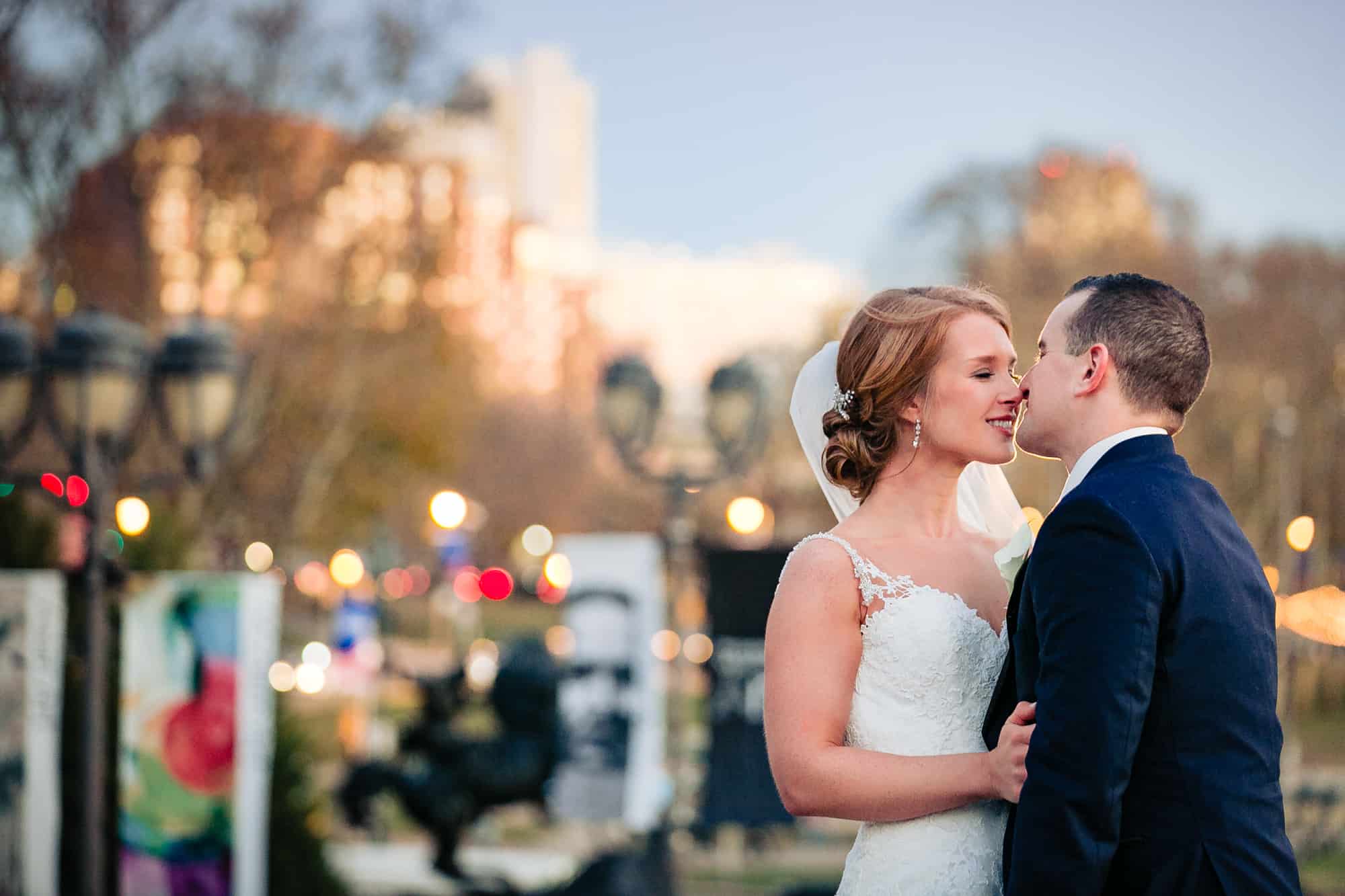 Bride and groom kissing in public