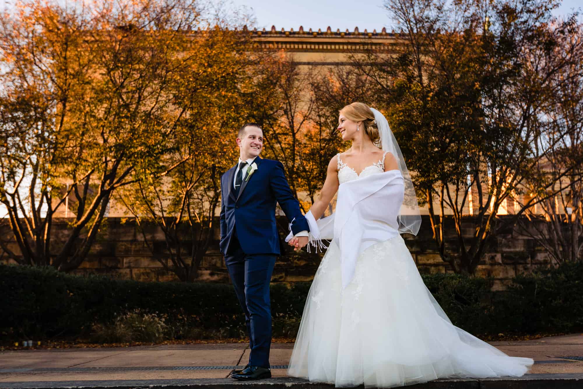 Bride and groom posing at the Philadelphia Museum of Art
