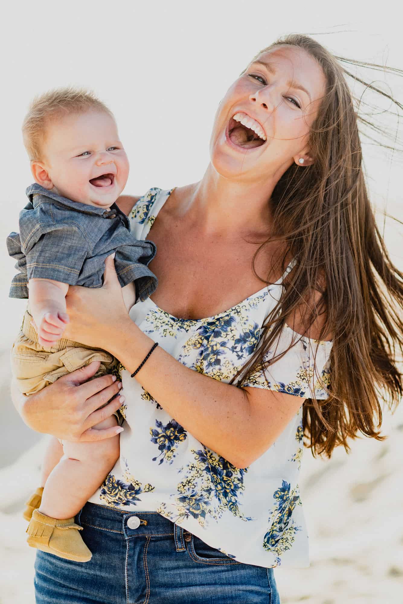 mom and baby son laughing during their Family Photo Session