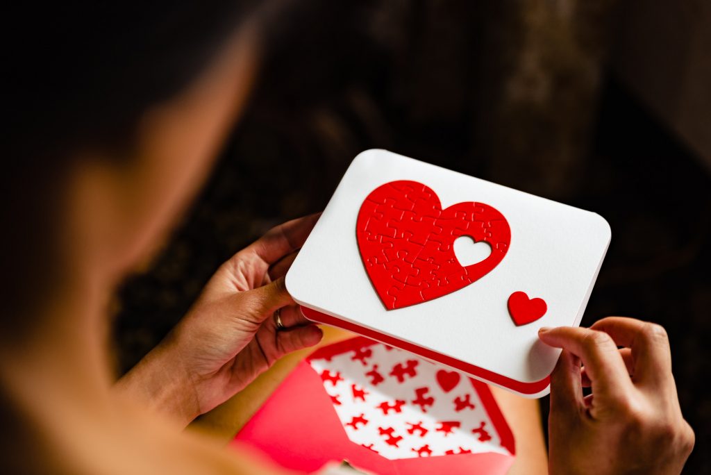 Bride holding a card with a heart on it