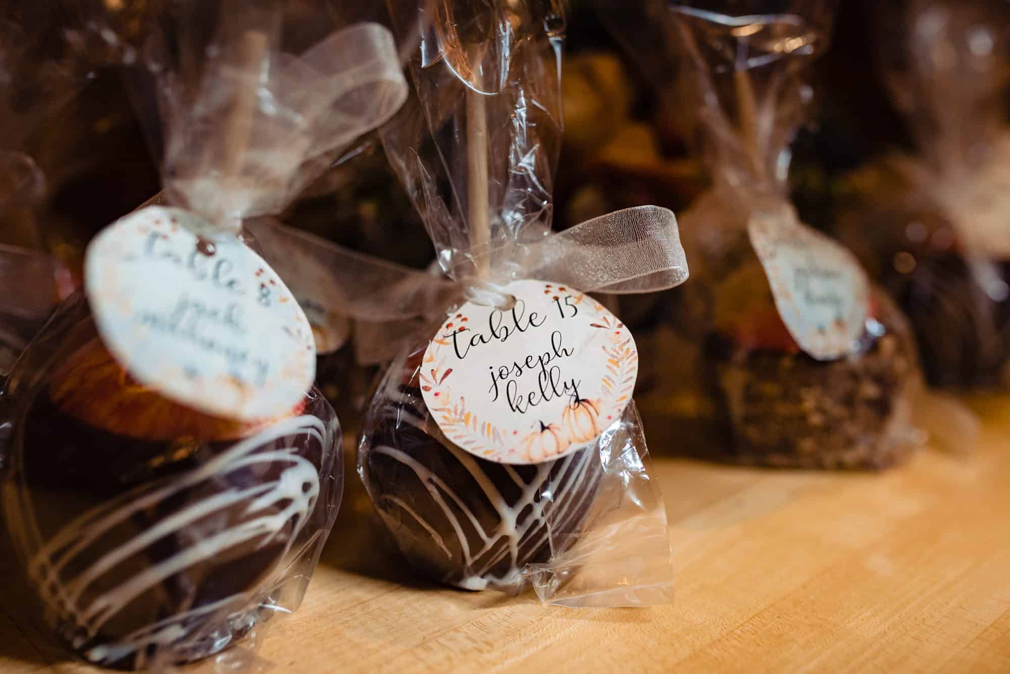 Caramel apple wedding favors with a bow wrapped around them