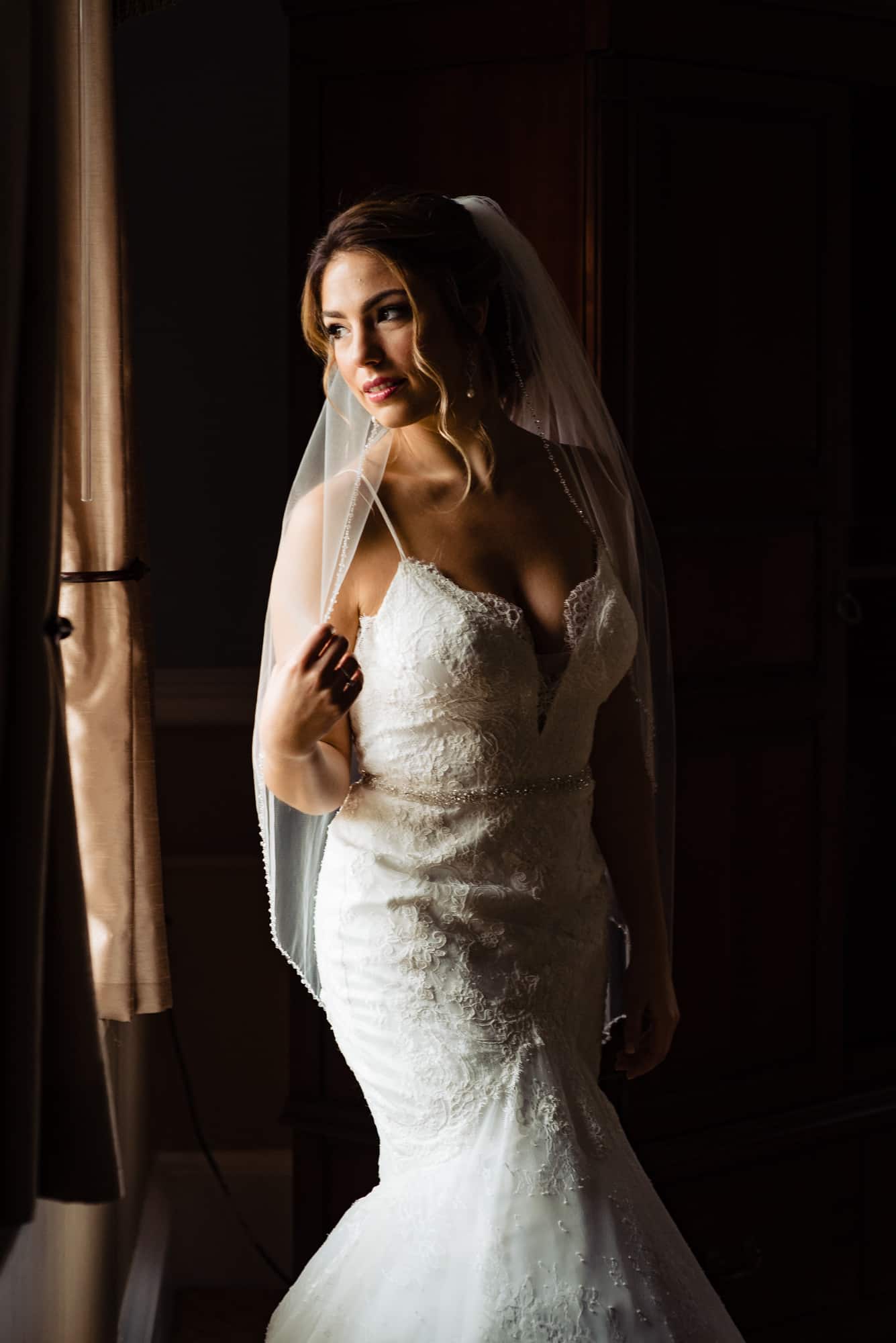 bride looking out of the window shot