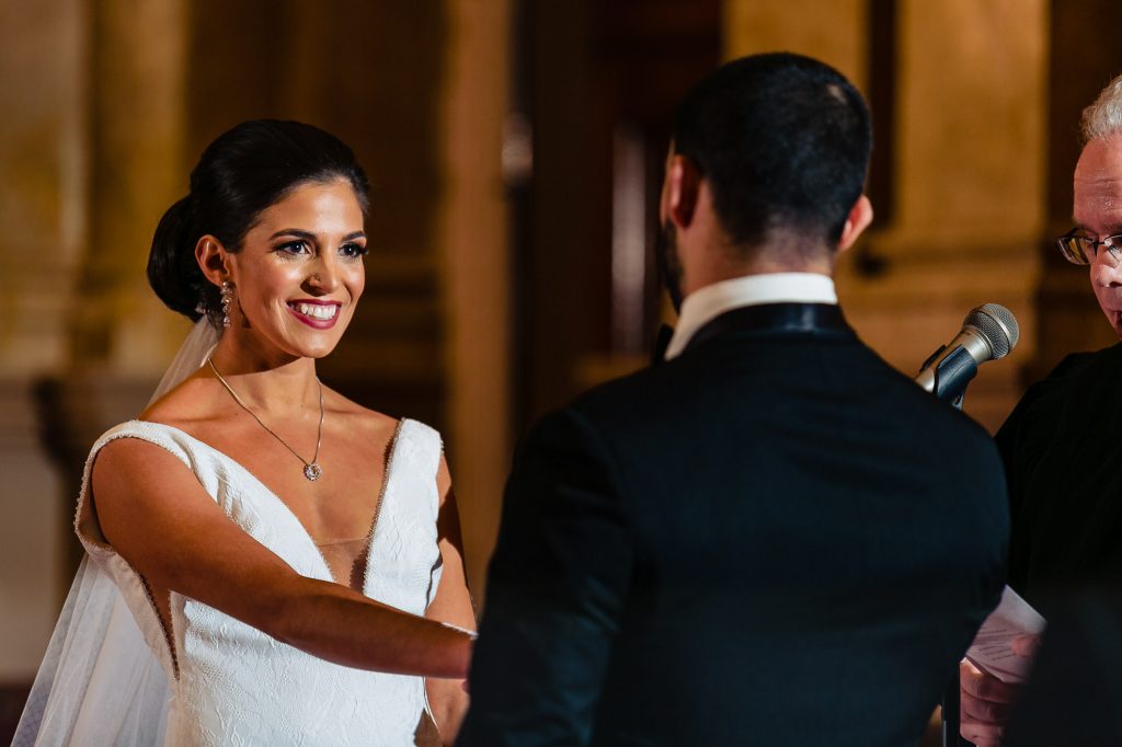 Bride smiling at groom