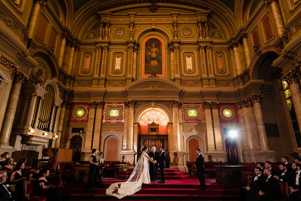 Bride and groom holding hands