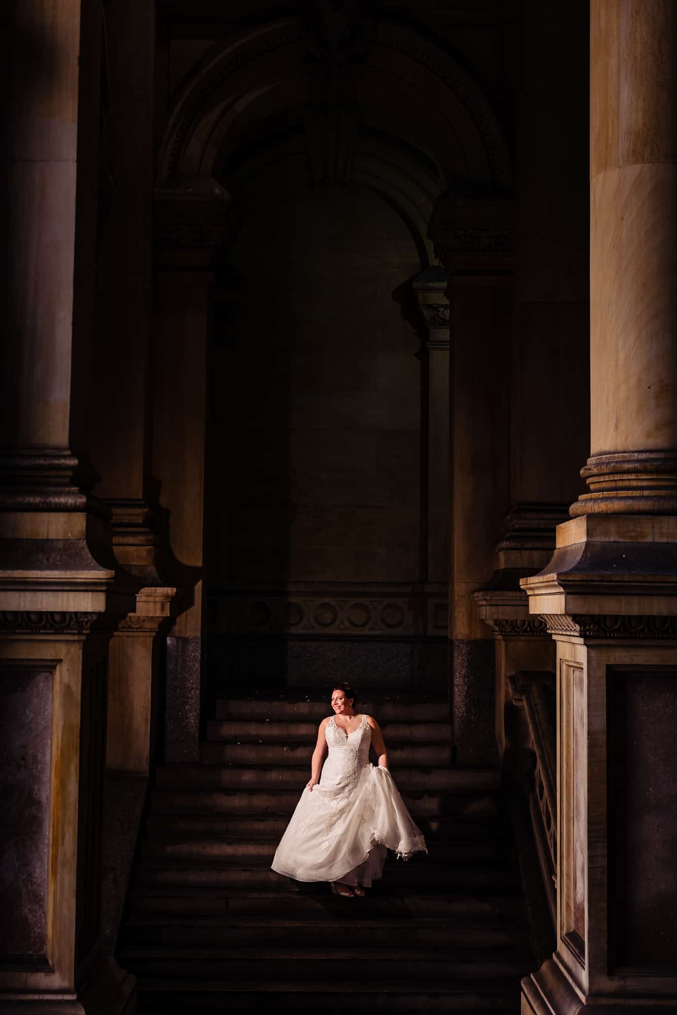 bride running down the staircase shot