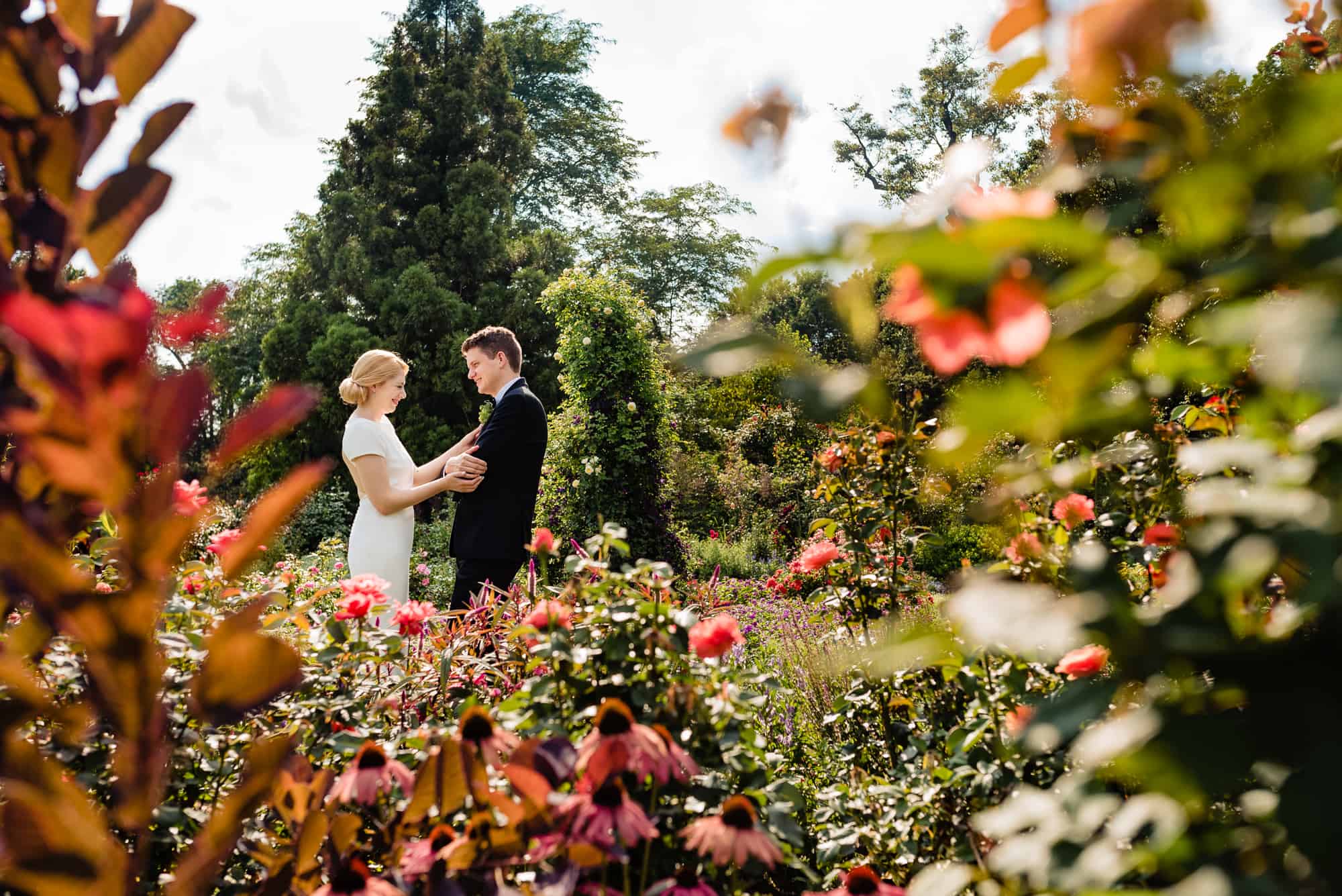 long shot of the bride and groom in the morris arboretum wedding garden