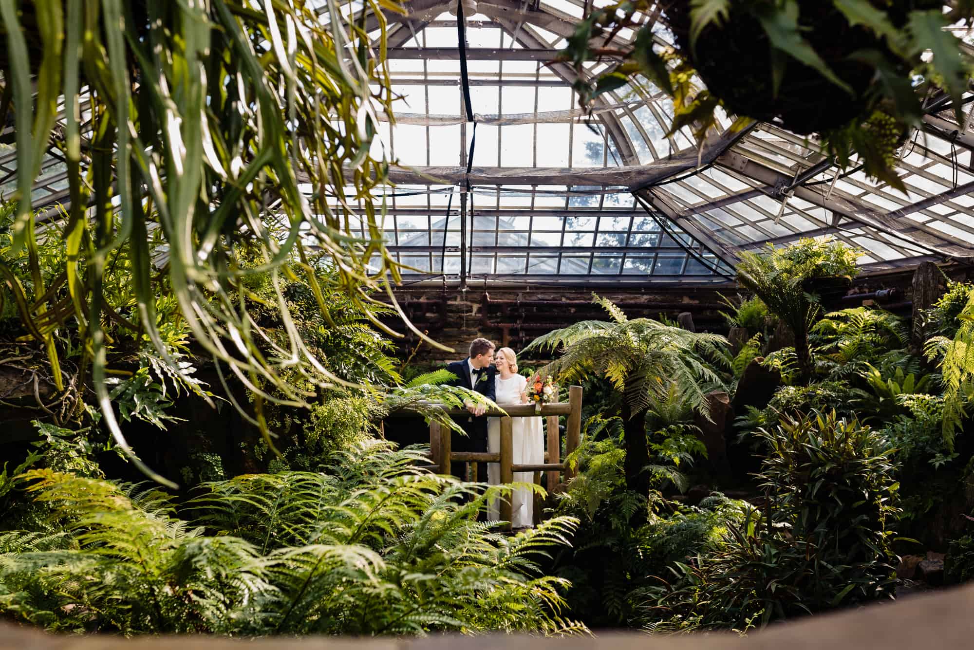 bride and groom looking into each others eyes at their Morris Arboretum Wedding