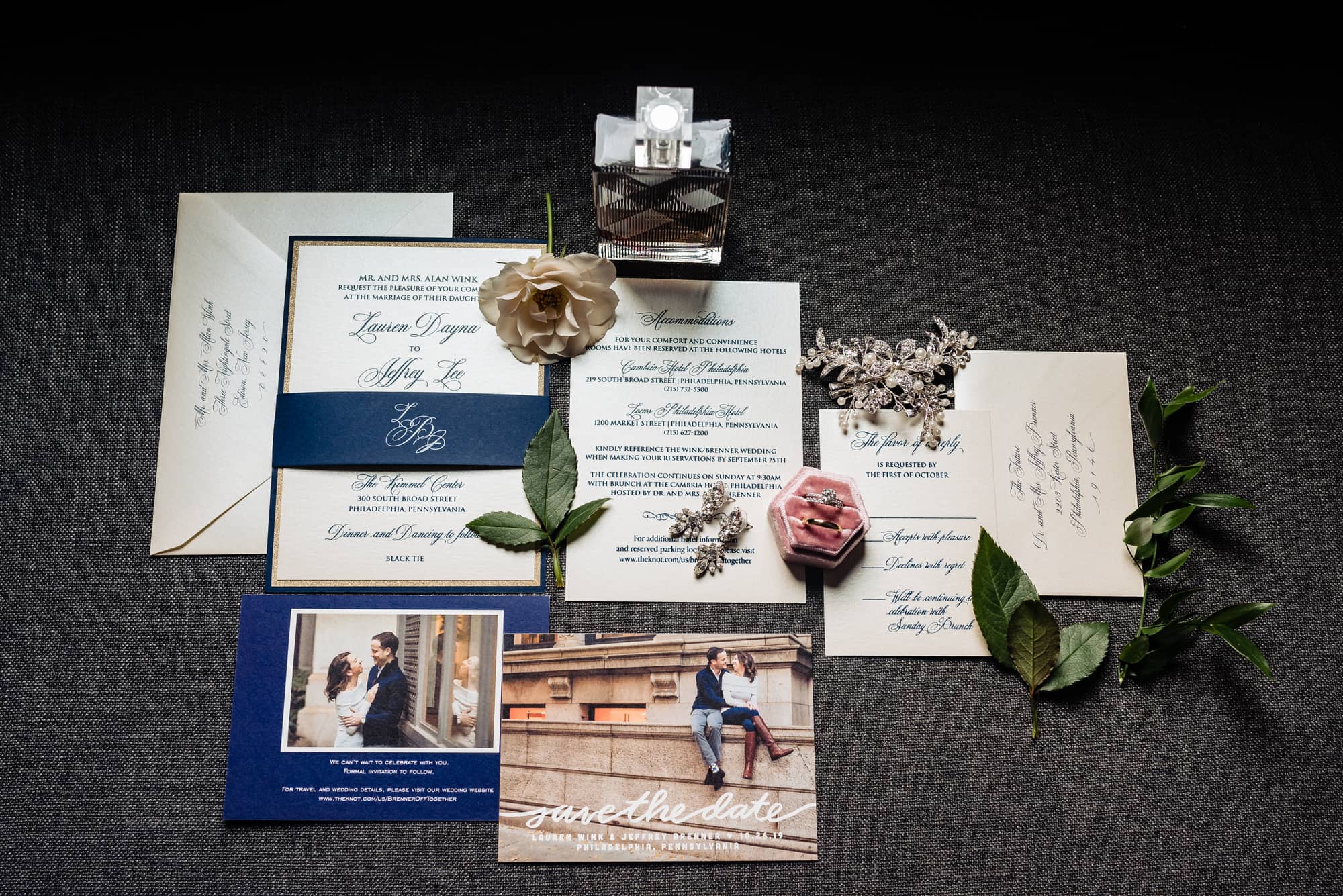 the wedding accessories such as the brooch, invites, boutonnieres