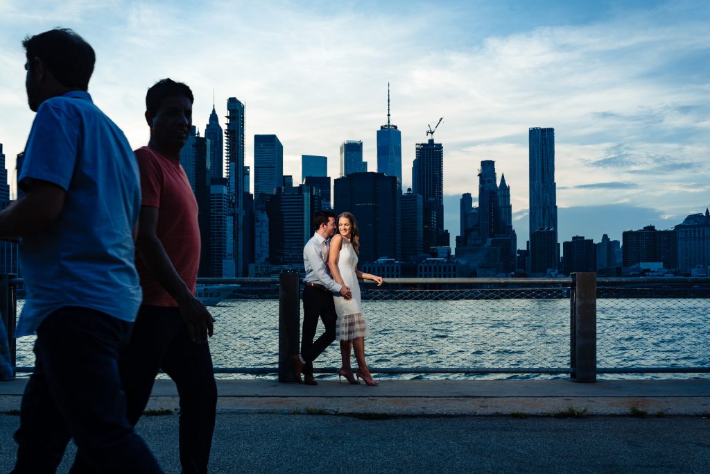 couple wearing light colors to stand out on dark backgrounds for their engagement session