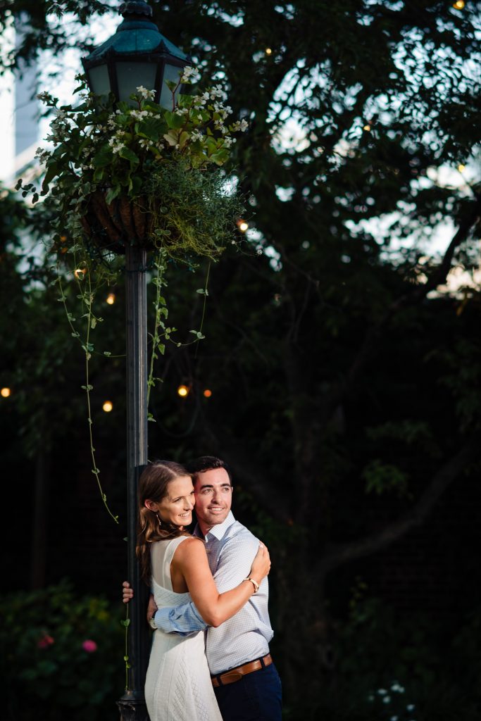 couple hugs each other for their Brooklyn bridge eshoot