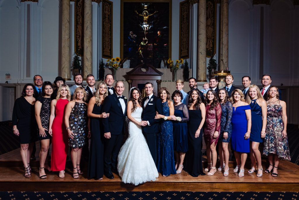 bride and groom with the guests shot