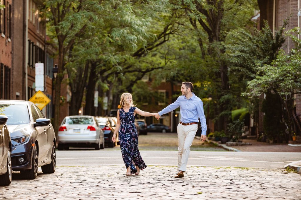 couple pose for their old city philly eshoot