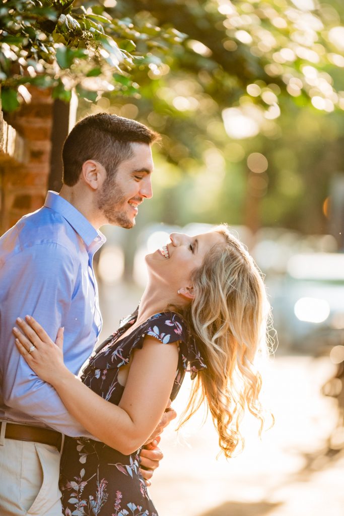 couple smiling at each other in their old city philly eshoot