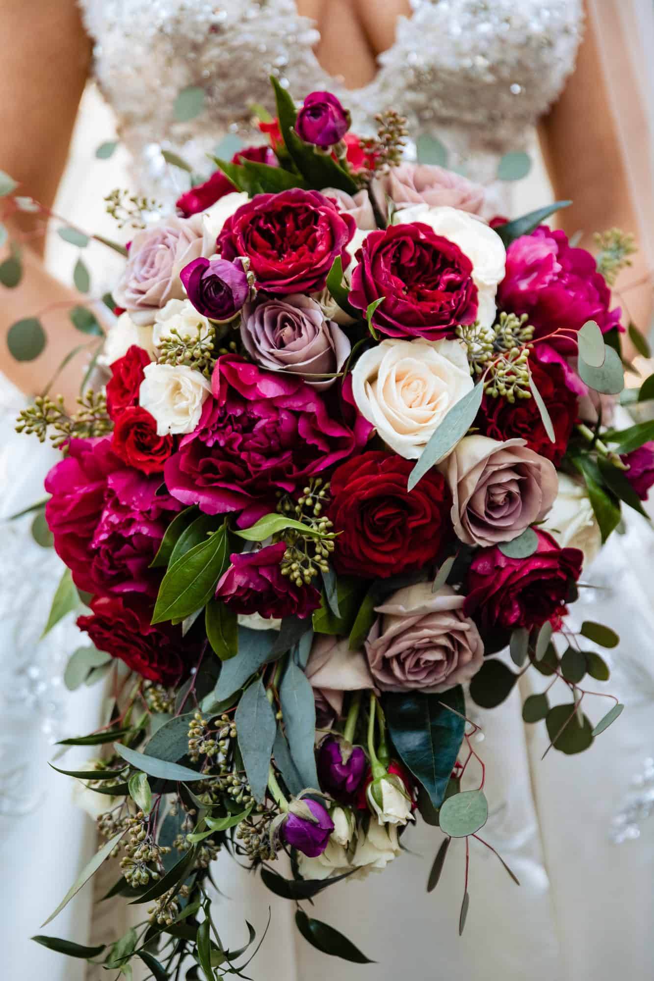 Wedding photographer captures a cole shot of the bride's wedding bouquet