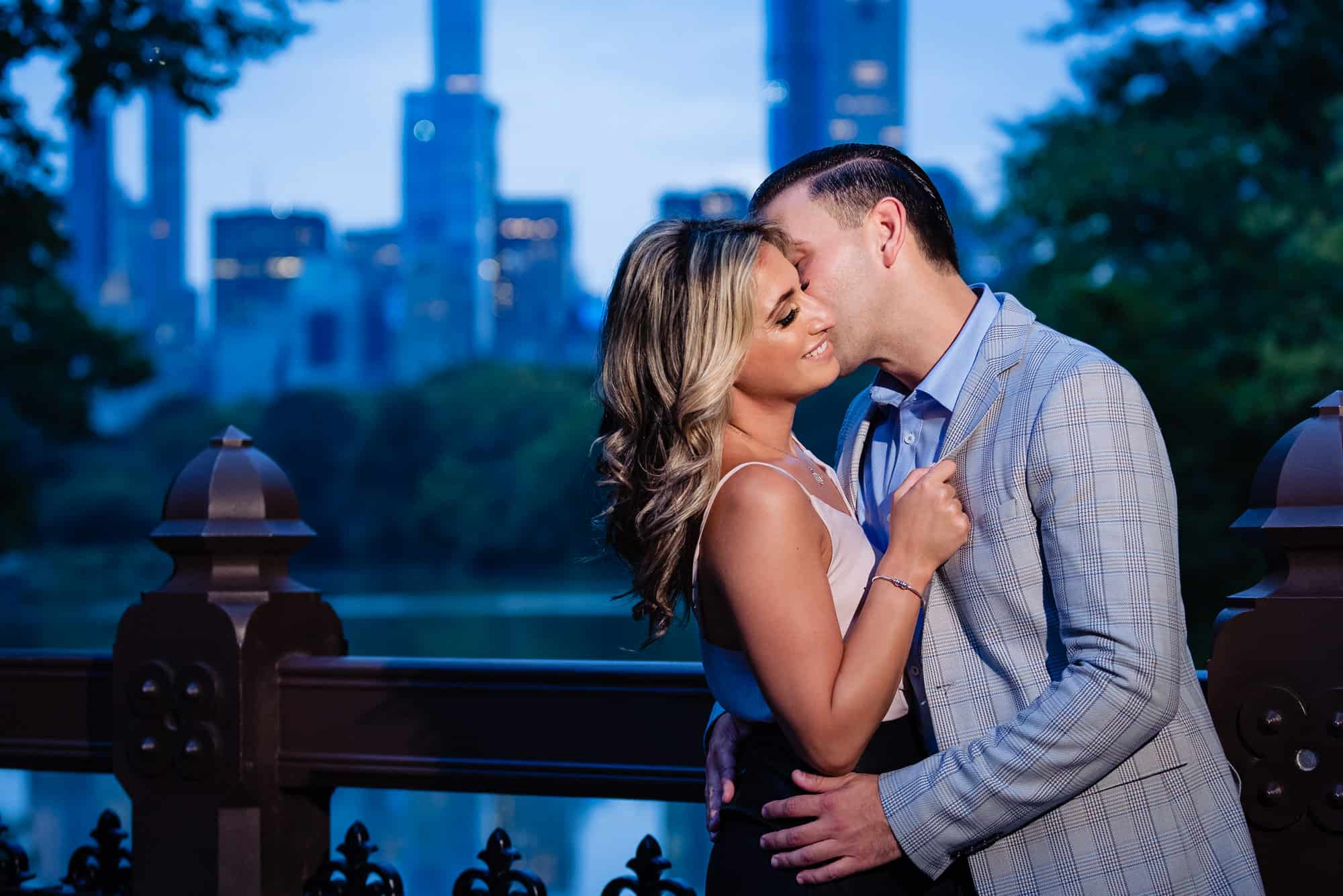 romantic evening shot of couple embracing in central park