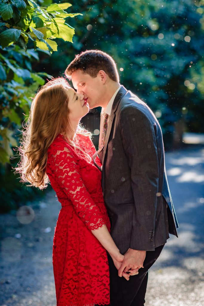 couple kissing on their dumbo e-session
