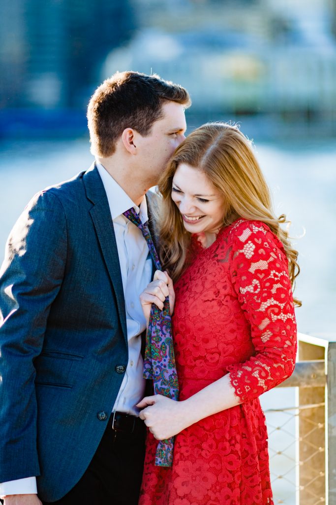 intimate moment between the couple in their dumbo e-session