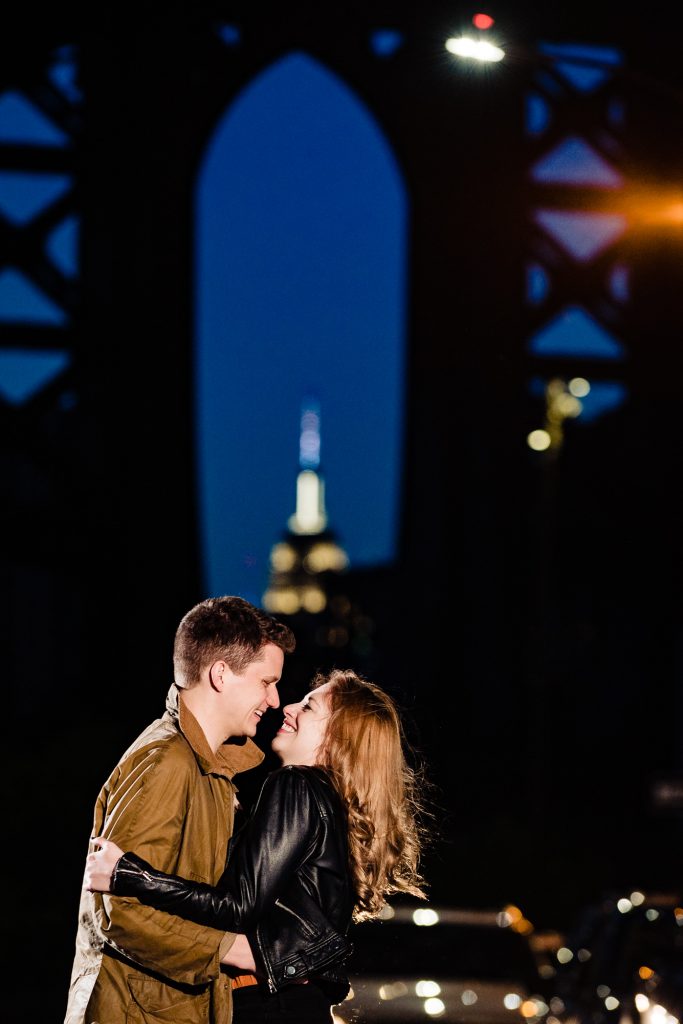 couple is taking a pose during their DUMBO e-session.