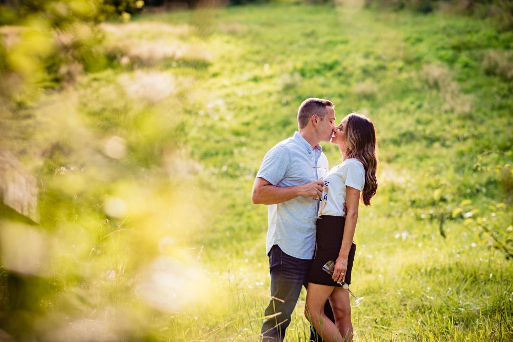 long shot of the couple kissing on their longwood gardens eshoot