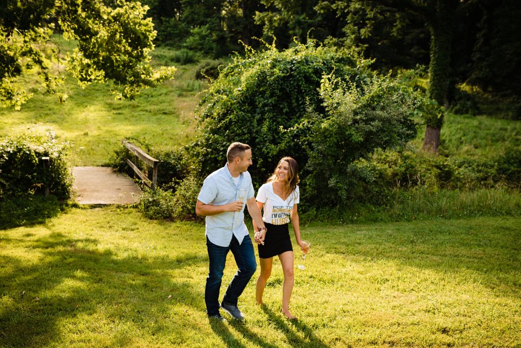 couple smiling at each other while walking