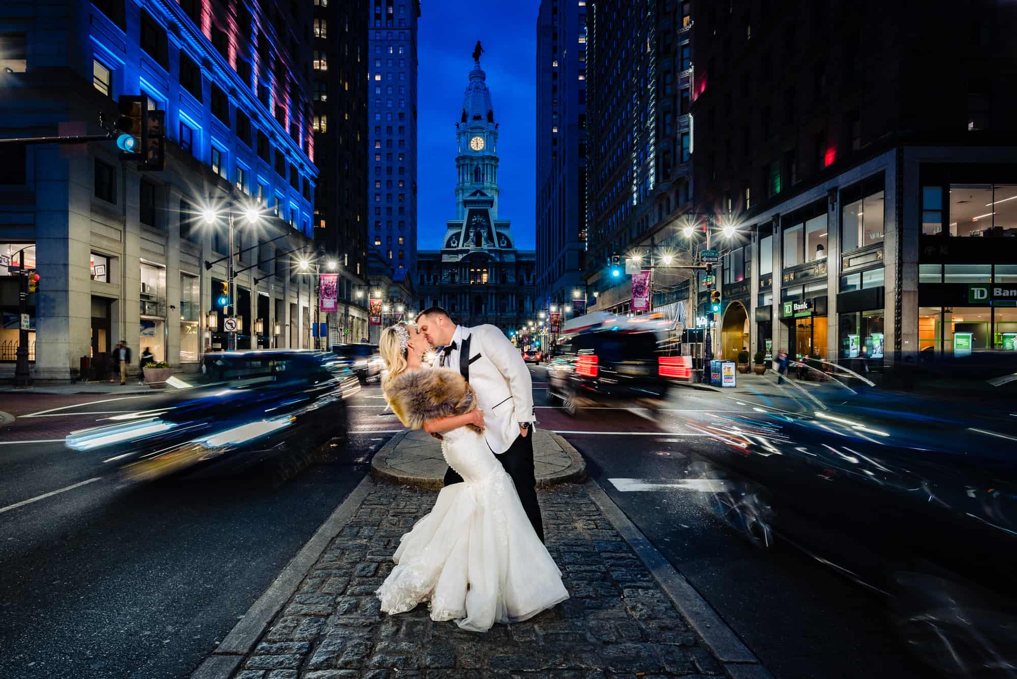 Bride and groom kissing in the middle of the city's street for everything you need to know about a city wedding article