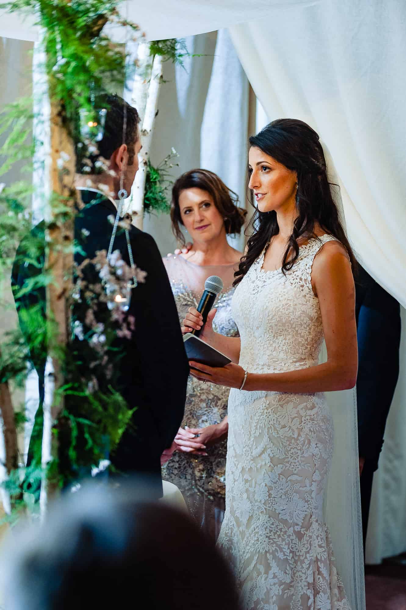 Bride saying her vows to the groom