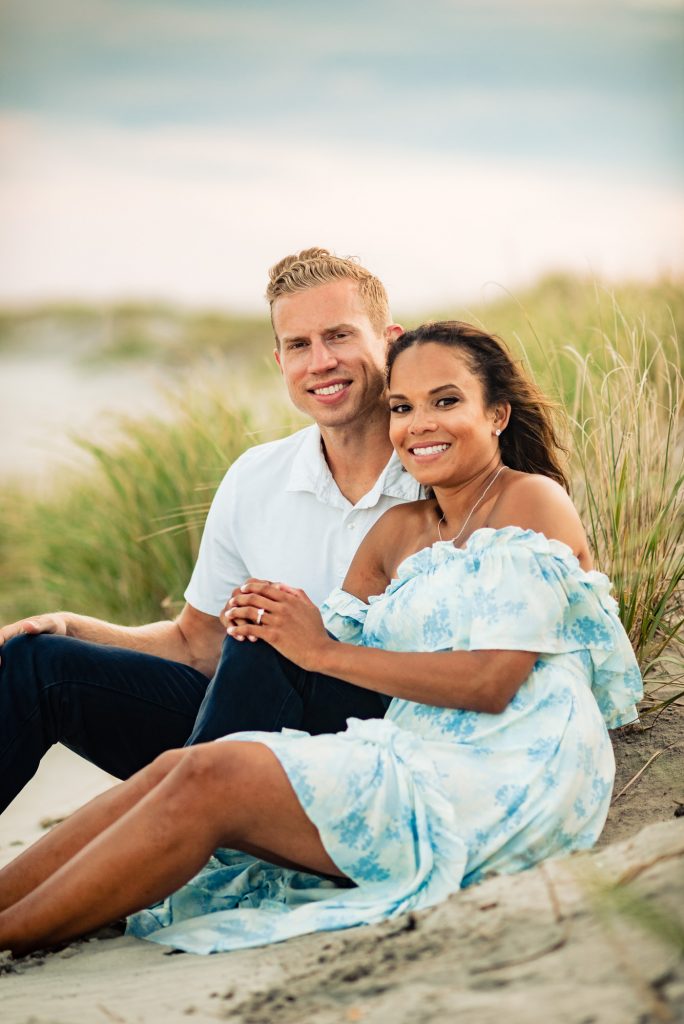 tiff & kyle sitting on the beach avalon nj e-session