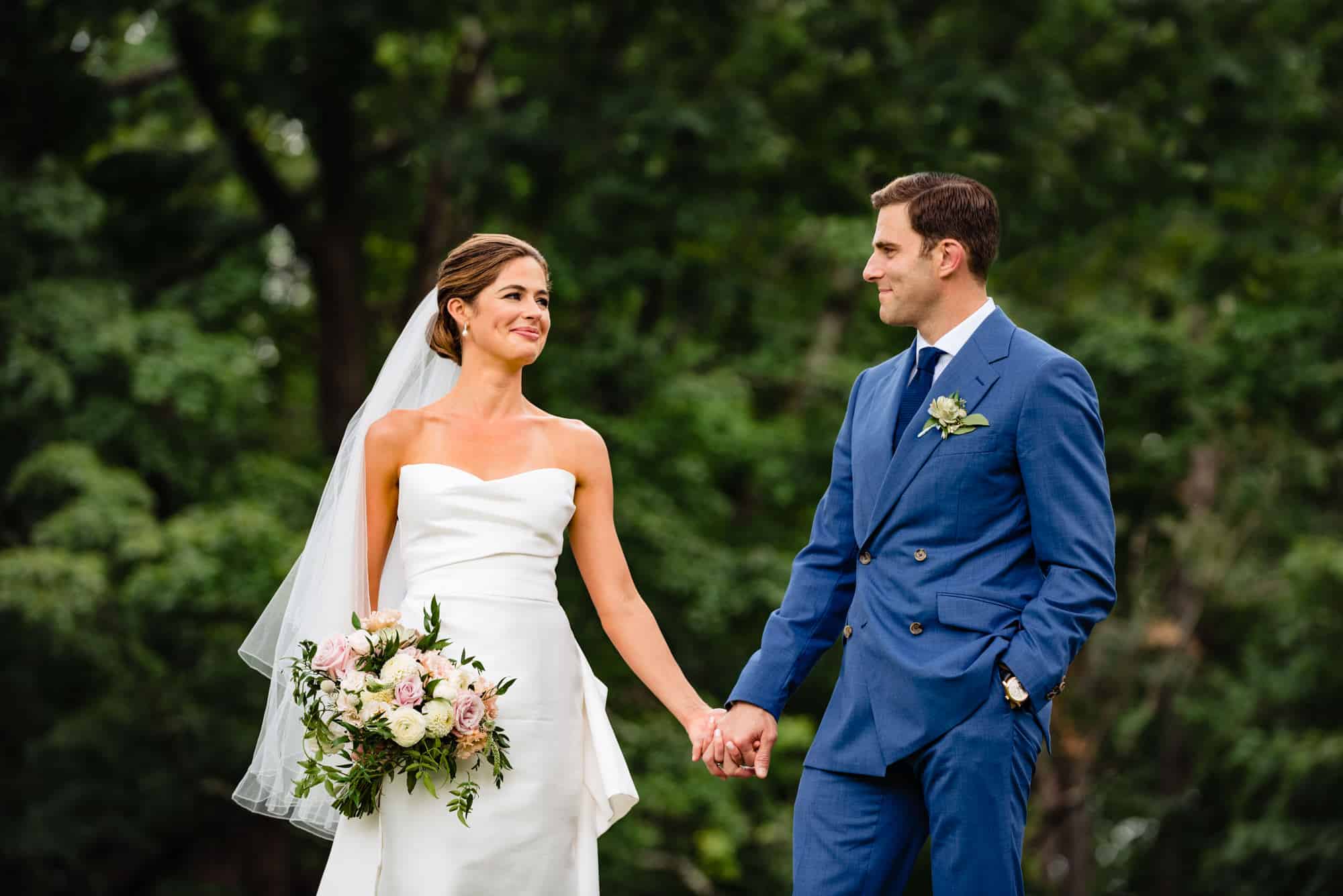 newlyweds holding hands is one of the Top Wedding Day Poses