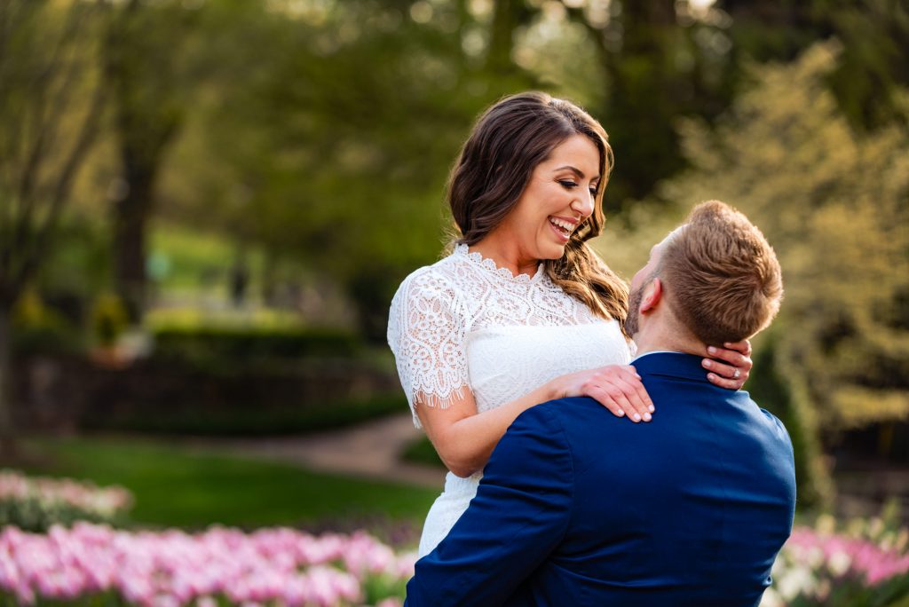 couple taking a pose during their Longwood Gardens Spring e-session