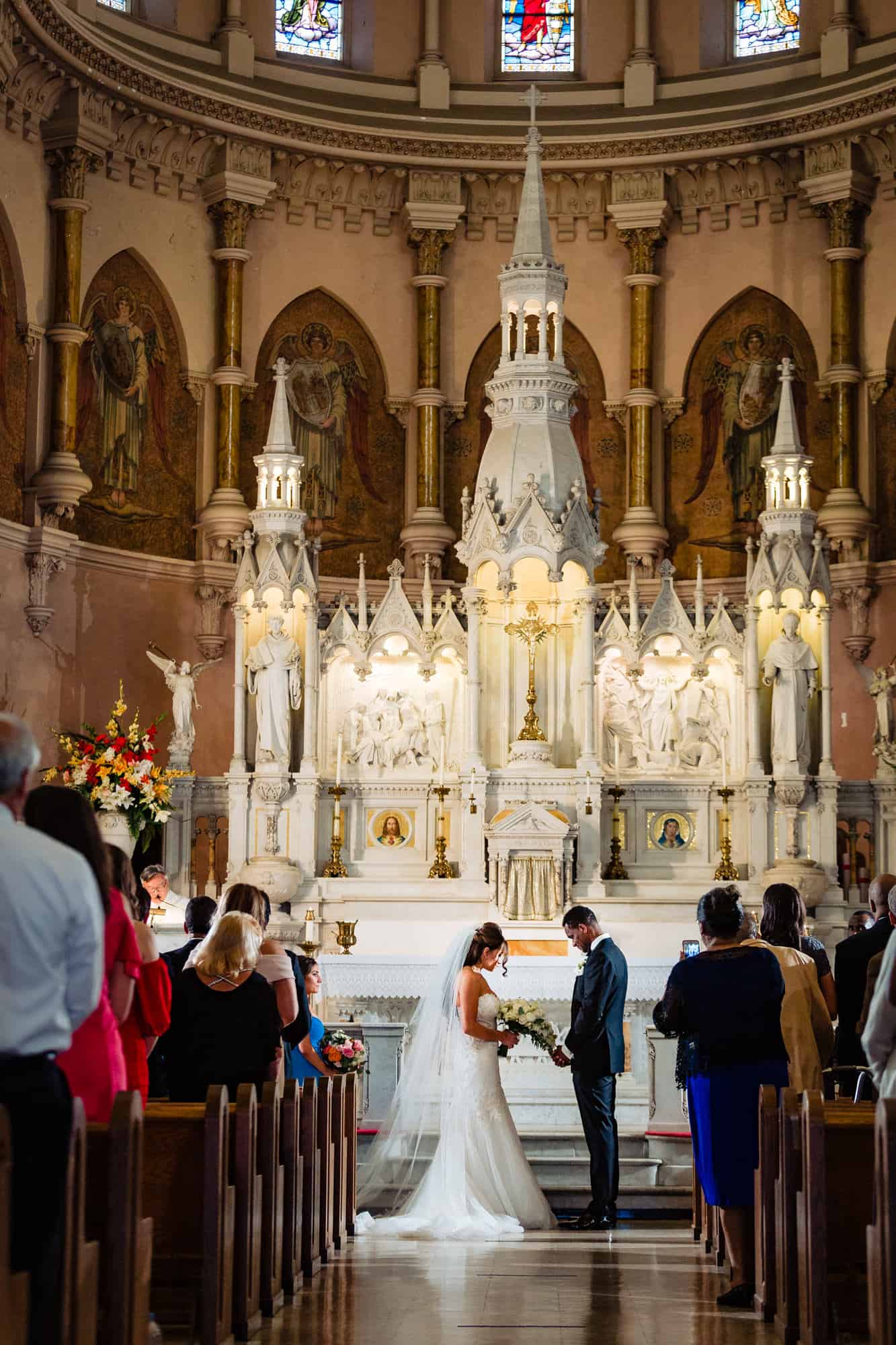 bride and groom on the altar