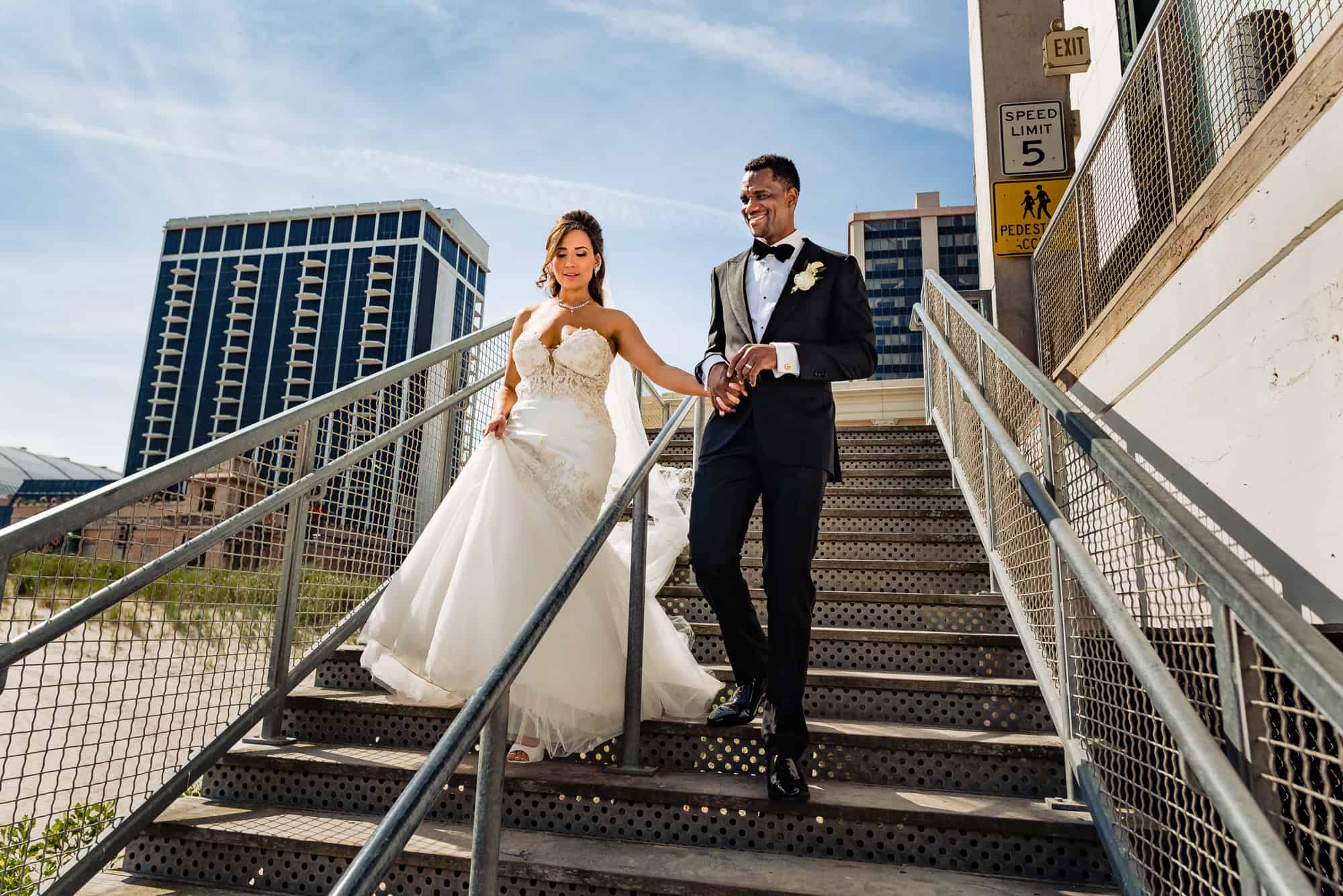 bride and groom walking down the stair before the wedding ceremony