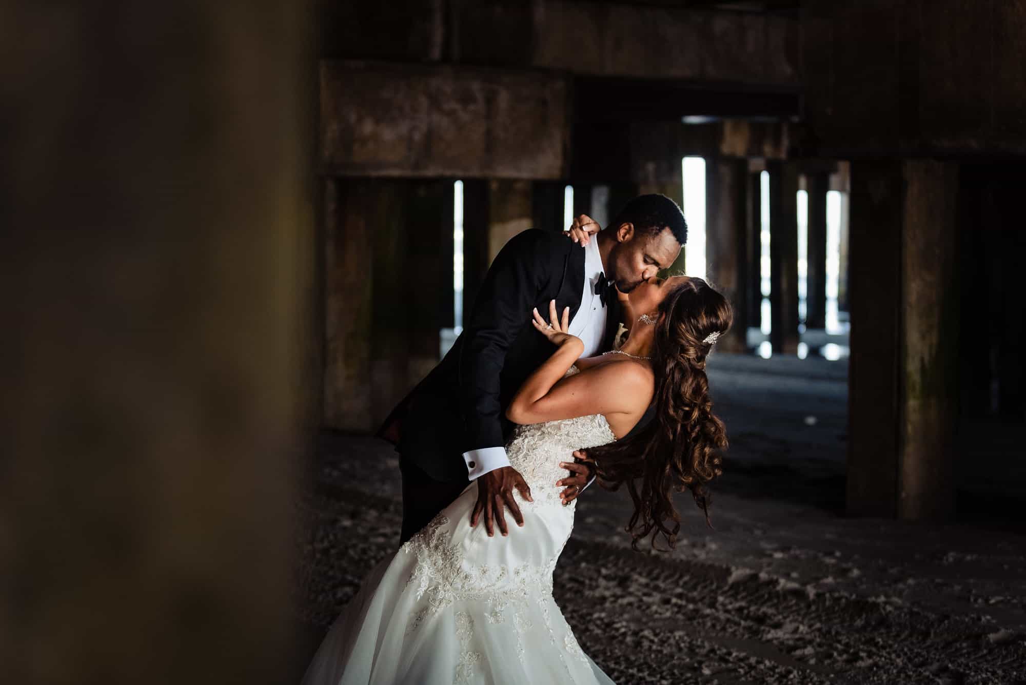 the bride and groom portrait taken along the beach