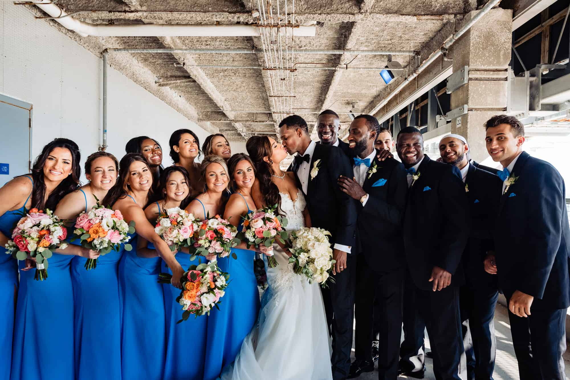 the newlyweds together with their entire wedding entourage