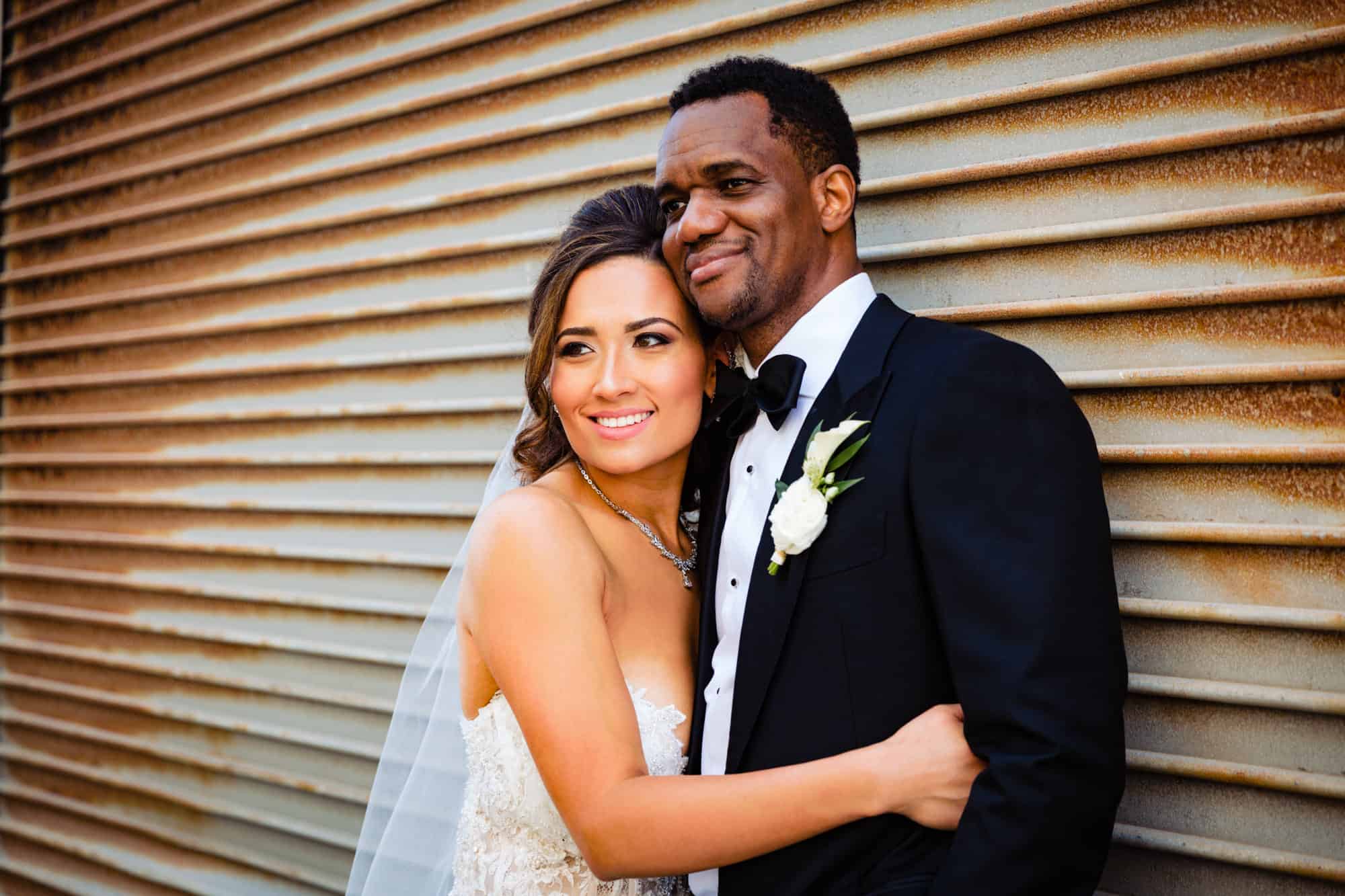 bride and groom pose before the wedding ceremony