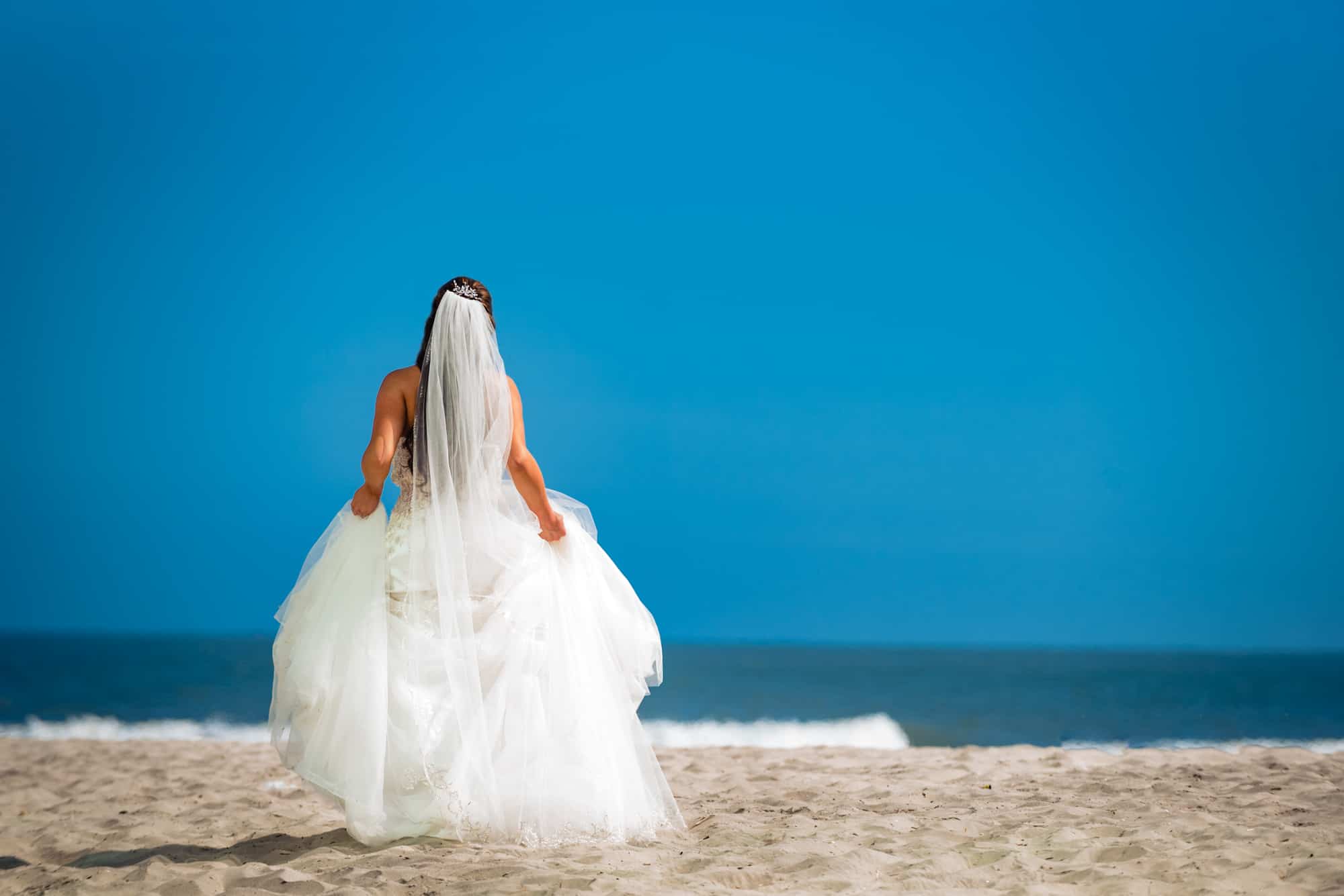 backshot of the bridal portrait taken along the beach