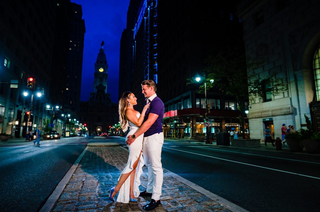 couple embracing on Broad Street near City Hall Philadelphia