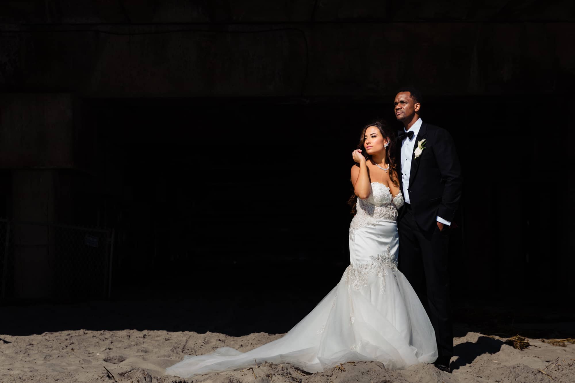 the bride and groom portrait taken along the beach