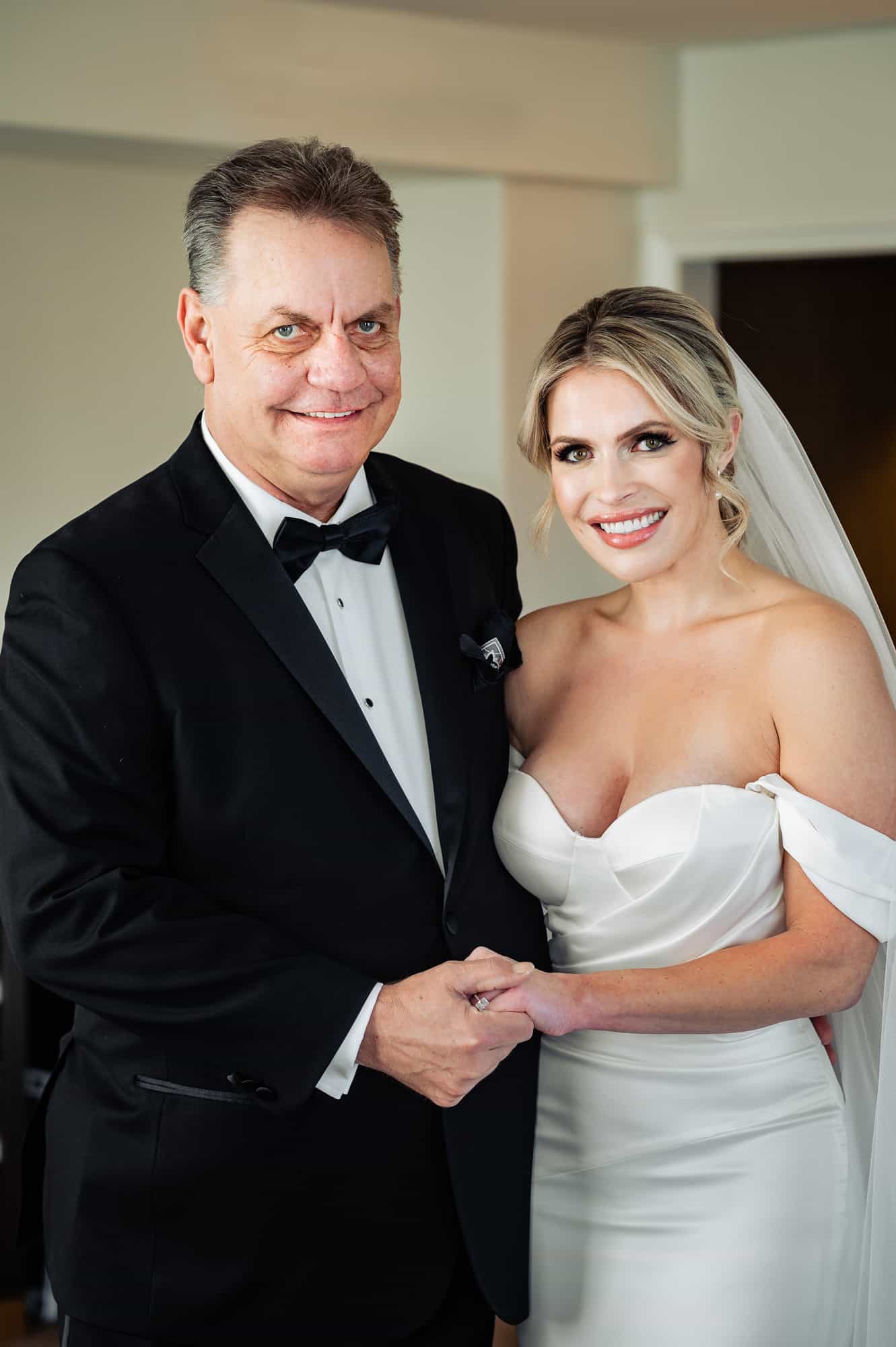 bride and her father smiling together