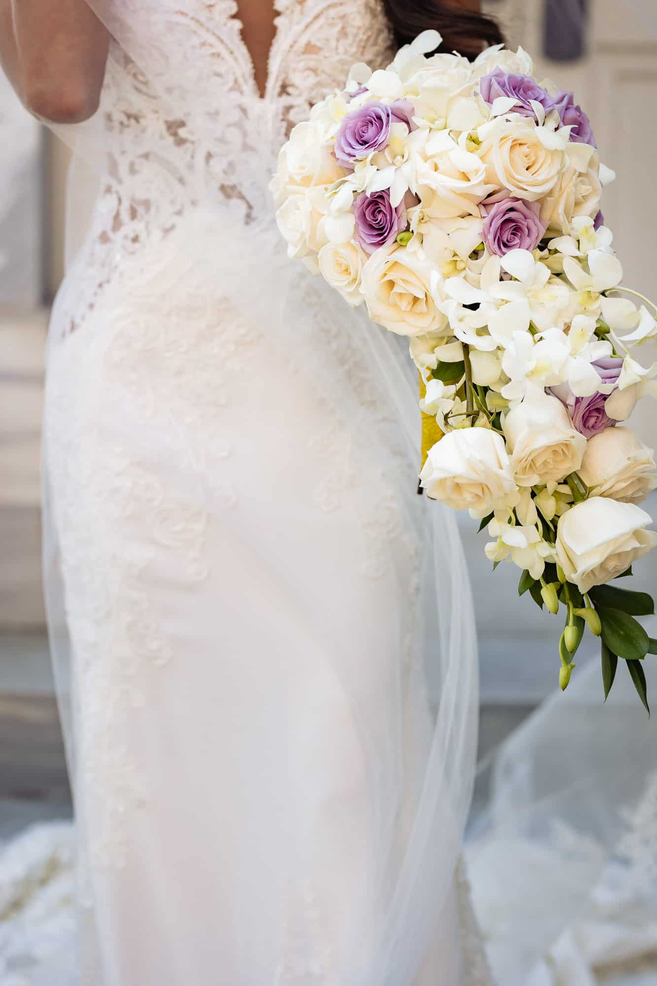 a bouquet of white and purple roses